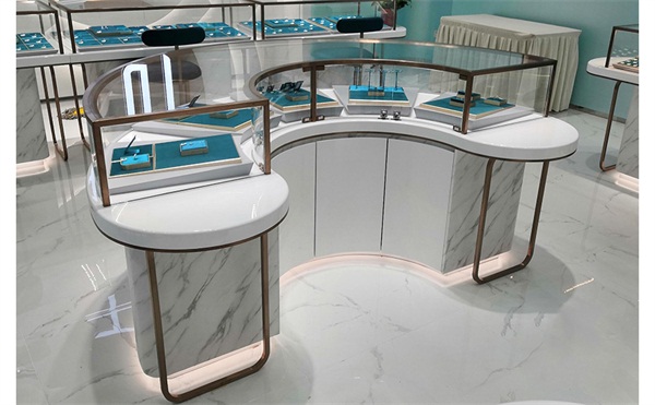 弧形不（bú）鏽鋼（gāng）大理石櫃台展示櫃_輕（qīng）奢不鏽鋼玻璃展櫃